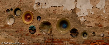 These bowls adorn the side of a building in Calvert, Texas.