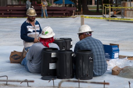Workers take a break from the heat of the day.
