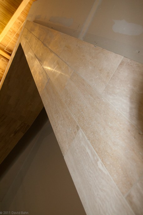 Travertine tile surrounds the rear exit to the sacristy from the chancel. Travertine tile surrounds the rear exit to the sacristy from the chancel.