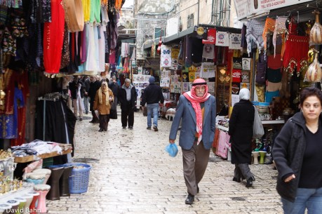 A Palestinian man walks through the bazaar in the Old City of Jerusalem. A Palestinian man walks through the bazaar in the Old City of Jerusalem.