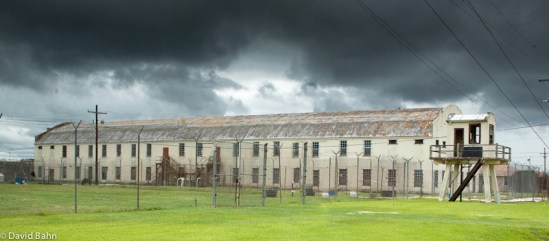 Dark Clouds Over Abandoned Prison Building Dark Clouds Over Abandoned Prison Building
